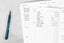 Ink+Volt fitness planner open with pen