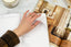 A hand turns the page of a 2024 planner