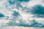 A bright sky filled with blue and white clouds