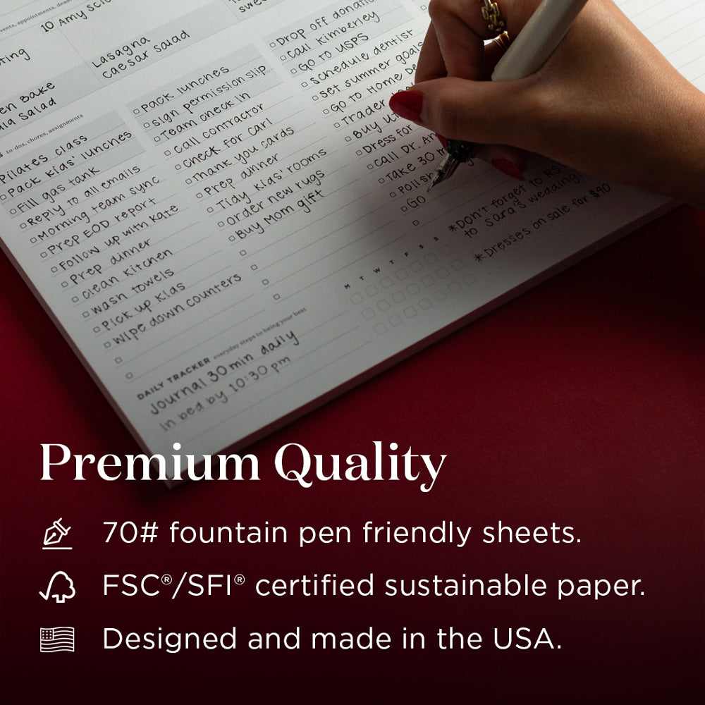 Hand writing on a notebook with text about premium quality and sustainability.